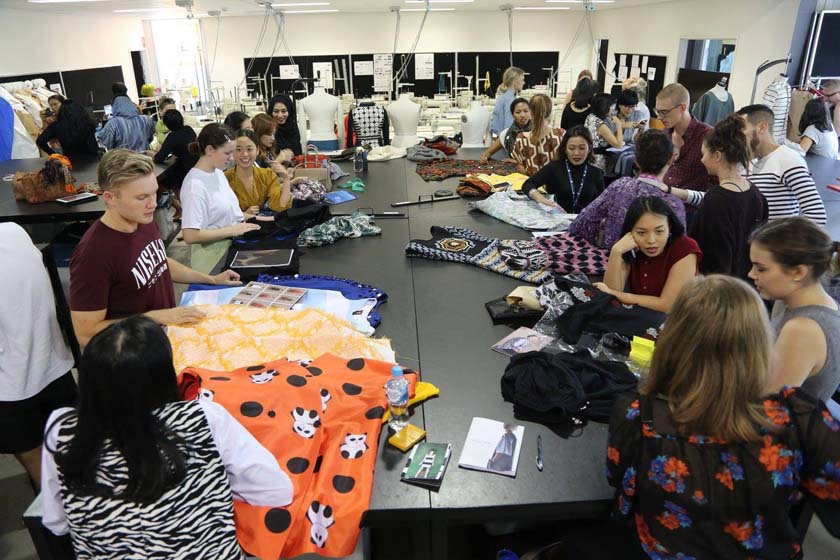 A fashion design studio full of students